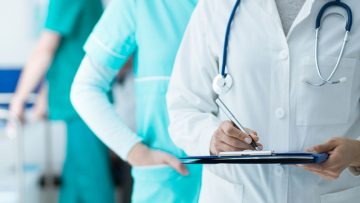 bigstock-Doctors-Checking-Medical-Recor-225737713